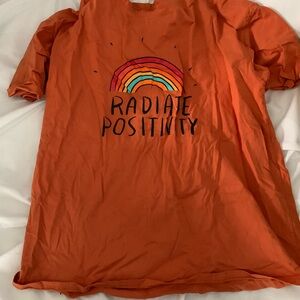 Vibrant Orange Tee with Rainbow Graphic
